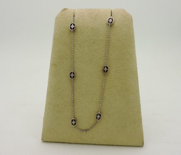 0.25 Carat Diamonds Retro Necklace hanging on carton