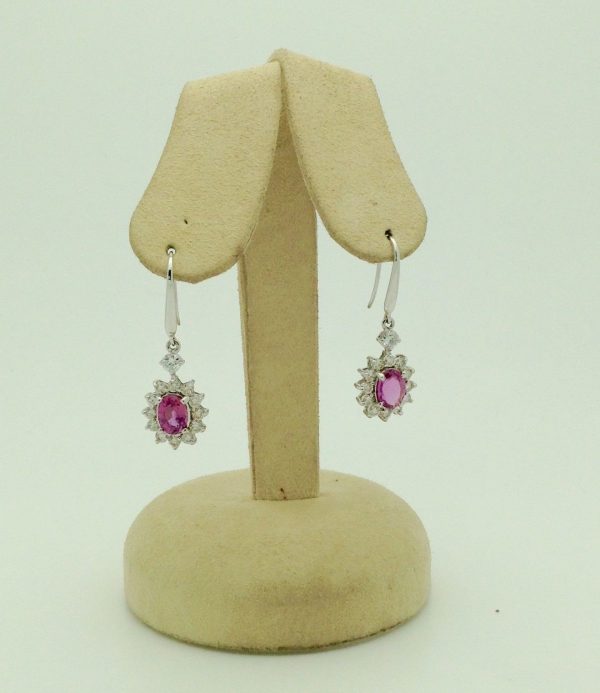 14K White Gold 2.0 CT Pink Sapphire Flower Earrings W/ 1.04 CT VS Diamond Halo hanging on fake ears