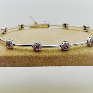 18Kt White Gold With 1.00Ct Tw of Diamond and .75Ct Sapphires Bracelet on a piece of carton