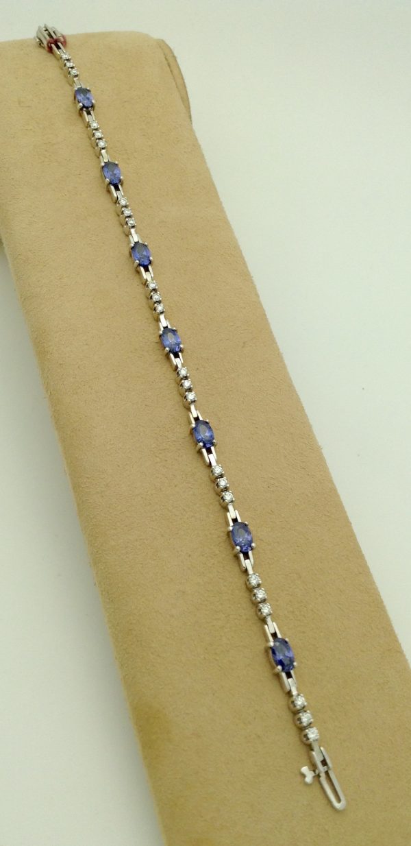 3.50 Ct Unheated Sapphire and 0.72 Ct Diamond Cocktail Tennis Bracelet 14k on a piece of carton