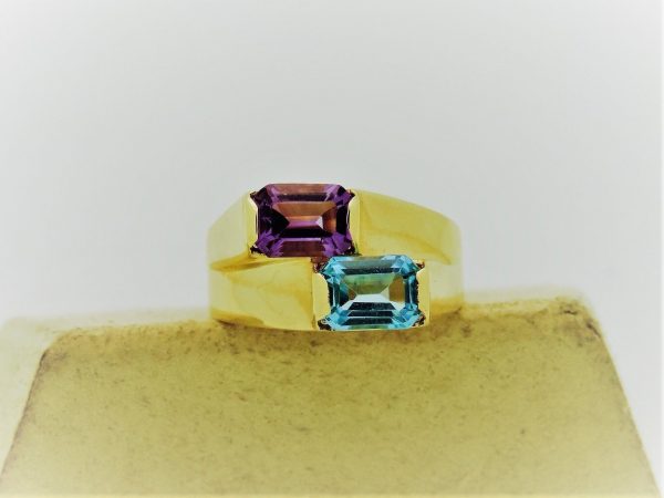 1.00 Ct Amethyst and 1.0 Ct Blue Topaz Retro Statement Ring 14k on a piece of carton