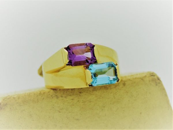 1.00 Ct Amethyst and 1.0 Ct Blue Topaz Retro Statement Ring 14k on a piece of carton