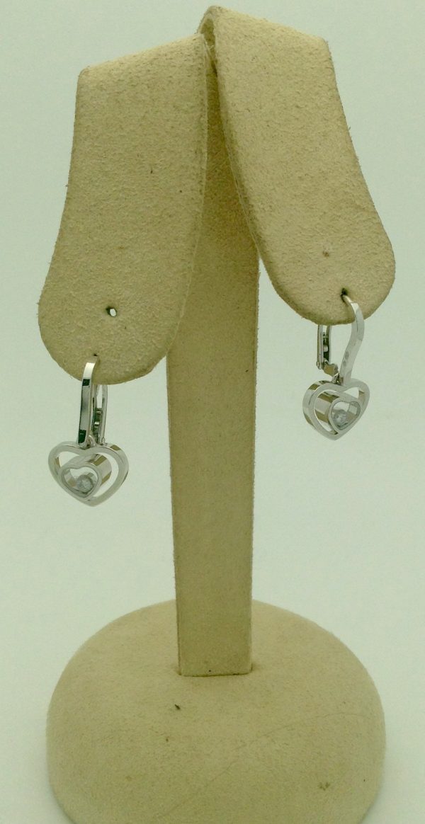 Front view of Chopard Happy Hearts White Gold Diamond Earrings 18k hanging on carton ears