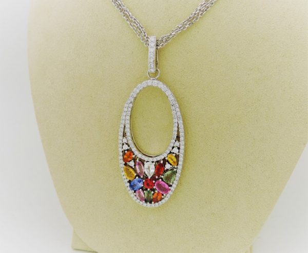 7.00 Ct Sapphire Cocktail Necklace 18k 1.00 Ct Diamonds hanging on a carton neck