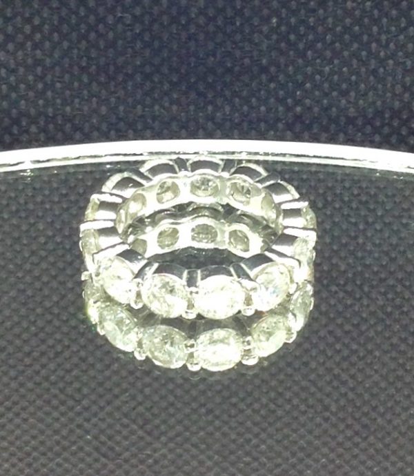14k White Gold 6.50 Ct Diamond Eternity Band G/SI2 on a piece of glass