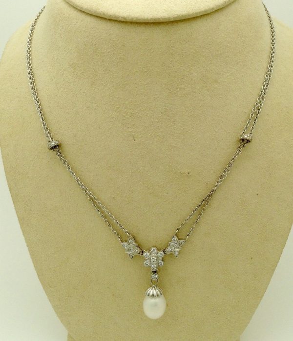 A front view of 1.00ct VS Diamond 14k White Gold Cluster Necklace w/ 11mm South Sea Pearl on a fake neck