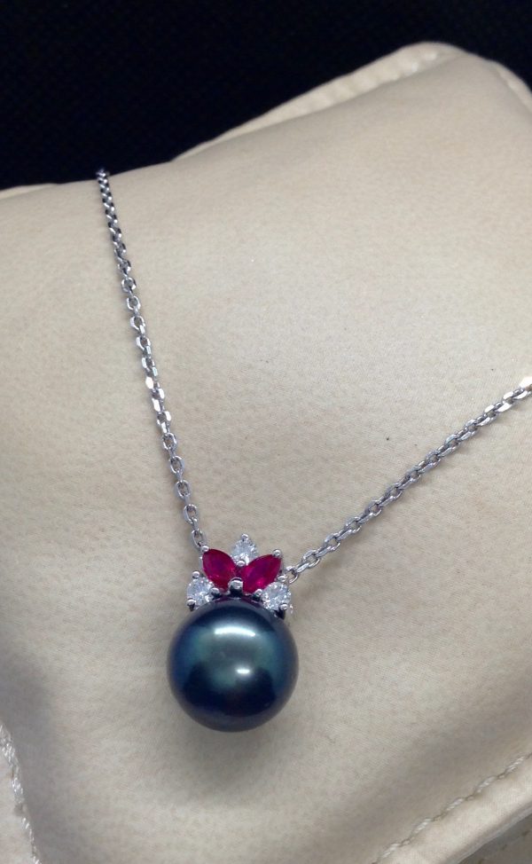 11mm Tahitian Pearl with 0.12 Ct Diamond and 0.20Ct Ruby 14k White Gold Pendant on a pillow
