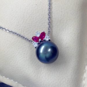 11mm Tahitian Pearl with 0.12 Ct Diamond and 0.20Ct Ruby 14k White Gold Pendant on a fake neck (front view)