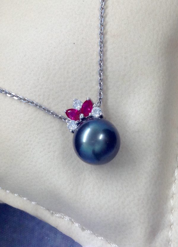 11mm Tahitian Pearl with 0.12 Ct Diamond and 0.20Ct Ruby 14k White Gold Pendant on a fake neck (front view)