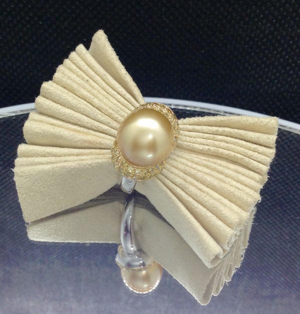 Flamboyant 12mm Golden South Sea Pearl with 0.74 Ct Canary Diamonds 18k White Gold Ring on a piece of glass