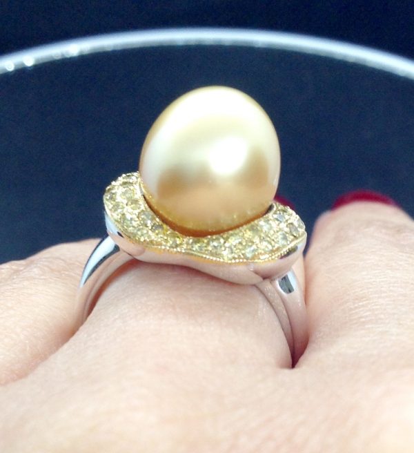Flamboyant 12mm Golden South Sea Pearl with 0.74 Ct Canary Diamonds 18k White Gold Ring on a woman's finger