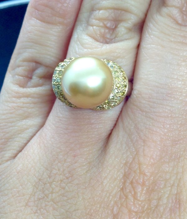 Flamboyant 12mm Golden South Sea Pearl with 0.74 Ct Canary Diamonds 18k White Gold Ring on a finger (front view)