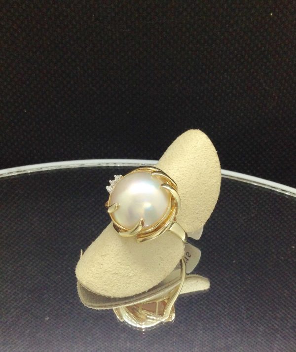 Alluring 13mm Mabe Pearl with 0.03 Ct Diamond Accents 14k Yellow Gold Ring on a fake finger (side view)