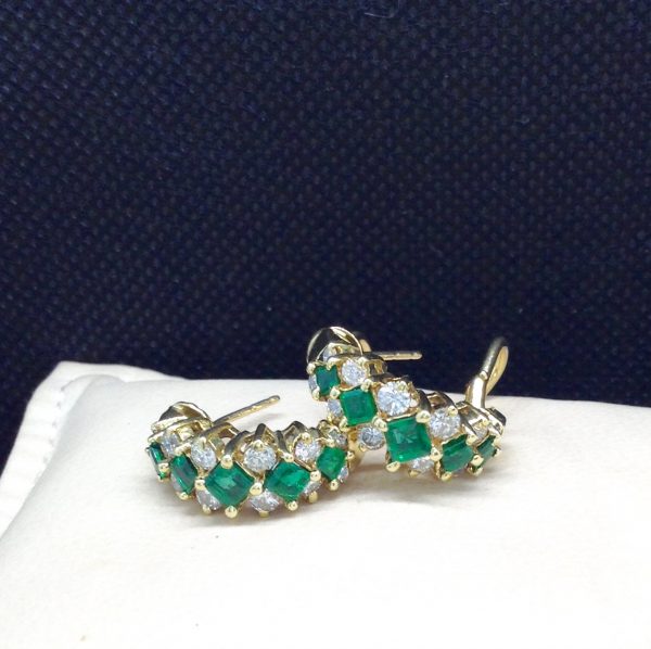 0.78 Ct Colombian Emerald with 0.75 Ct Diamond 18k Yellow Gold Huggies Cocktail Earrings on a pillow