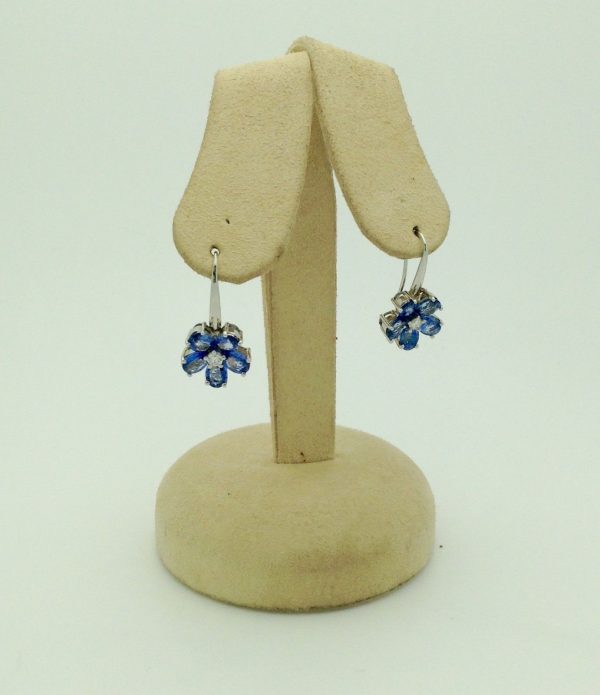 18K White Gold 6 CT Unheated Sapphire Flower Earrings W/ 0.60 CT VS Diamond hanging on fake carton ears