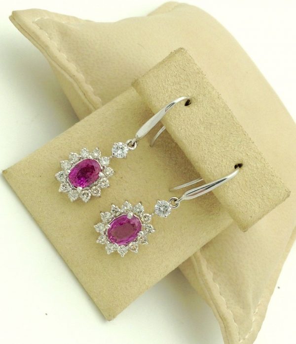 14K White Gold 2.0 CT Pink Sapphire Flower Earrings W/ 1.04 CT VS Diamond Halo hanging on carton