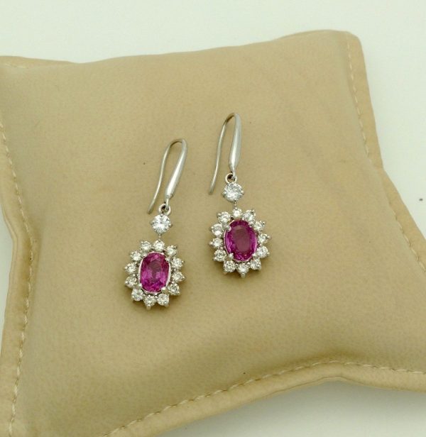 14K White Gold 2.0 CT Pink Sapphire Flower Earrings W/ 1.04 CT VS Diamond Halo on a pillow