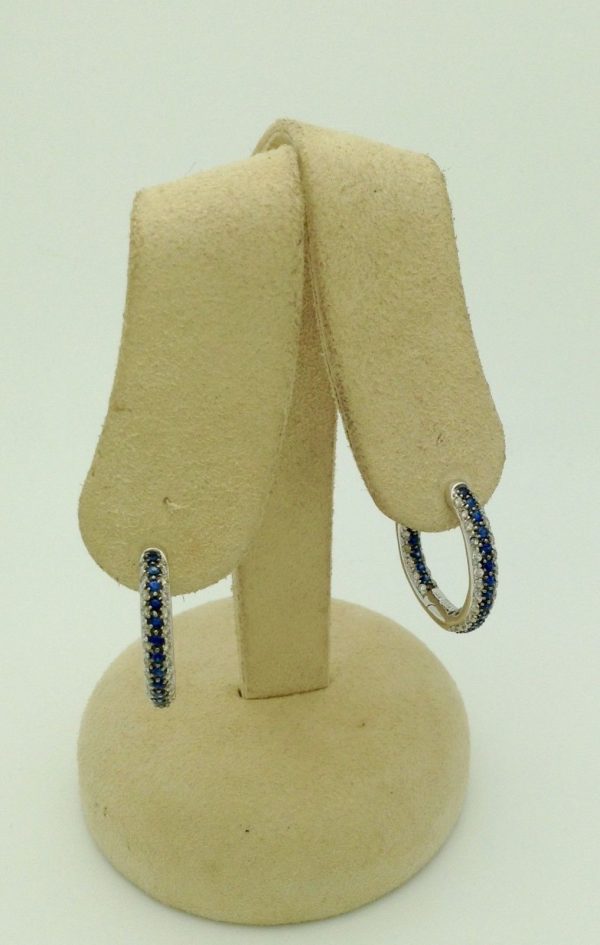 Two opened 18K White Gold 3.00 CT VS Diamond and Blue Sapphire Inside Out Hoops Gorgeous hanging on fake ears