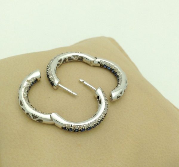 Two opened 18K White Gold 3.00 CT VS Diamond and Blue Sapphire Inside Out Hoops Gorgeous on a pillow