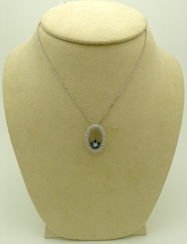 14k white gold diamond and sapphire necklace on a fake carton neck