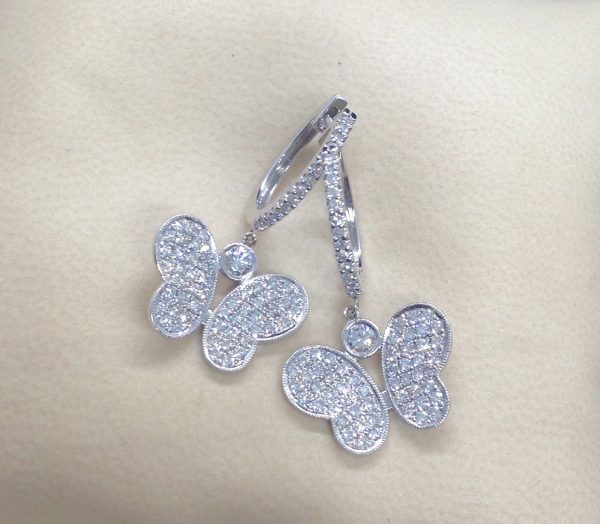 3.00 Ct Diamond Pave Butterfly 18k White Gold Dangle Earrings with Diamond Hoops on a pillow