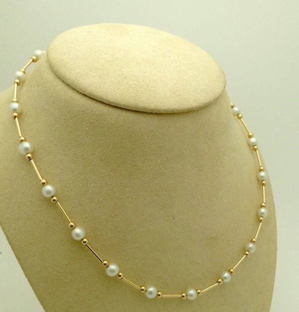 Classy 4mm Akoya Pearls w/ 14k yellow gold beads and bars on a fake neck