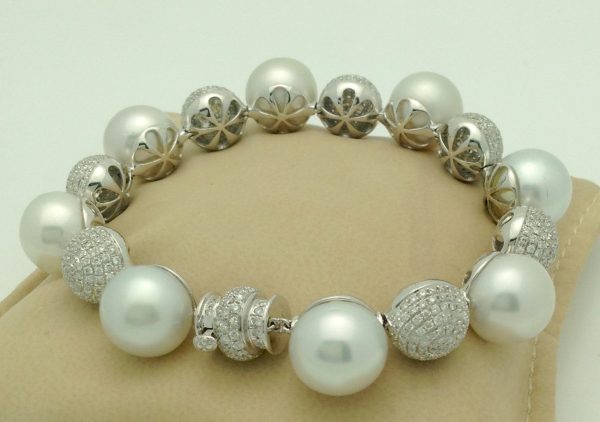 Unique 18k White Gold 6.00 Ct Diamond and 6mm South Sea Pearl Bracelet on a pillow