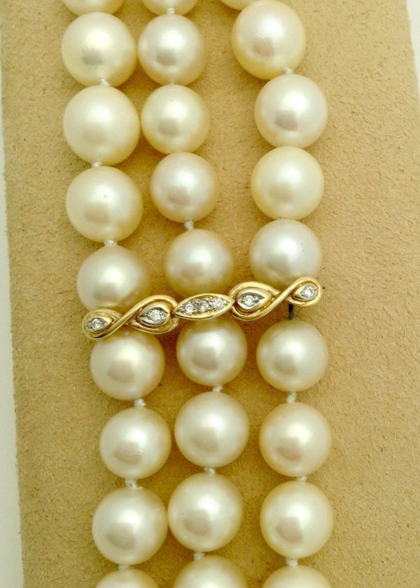 3 Row South Sea Cultured Pearls 8mm 18k Yellow Gold Clasp w/ VS Diamonds accents on a platform