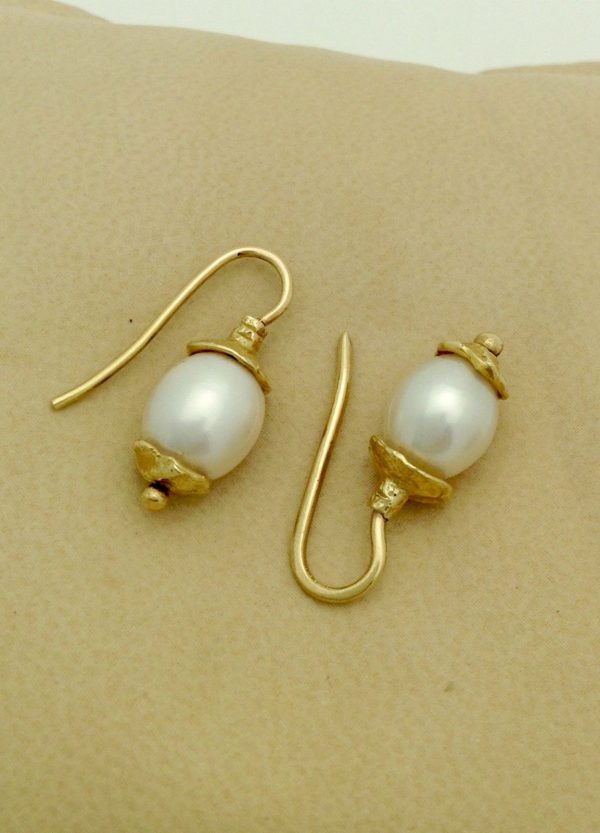 Two Short Drop South Sea Cultured 10mm Pearls w/ 14k Yellow Gold Rustic Accents on a pillow