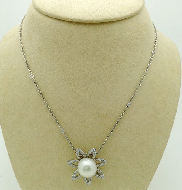 2.0 CT VS Diamond Flower w/ 11m South Sea Pearl & Diamond by the yard 18k Chain hanging on a fake neck