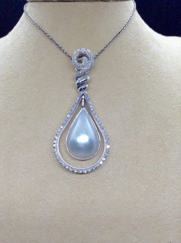 Front view of 18.7 Ct Mabe Pearl with 1.00 Ct Diamond 14k White Gold Pendant with 16" 14k White Gold Chain hanging on a fake neck