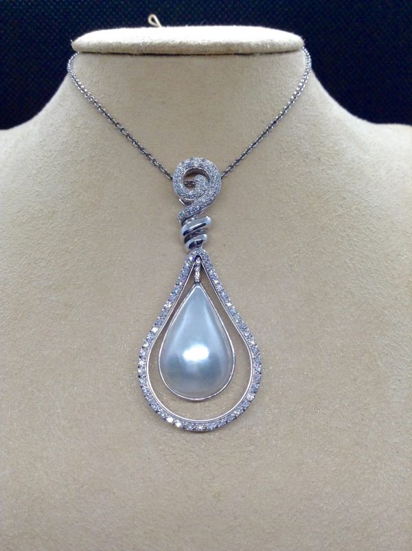 Front view of 18.7 Ct Mabe Pearl with 1.00 Ct Diamond 14k White Gold Pendant with 16" 14k White Gold Chain hanging on a fake neck