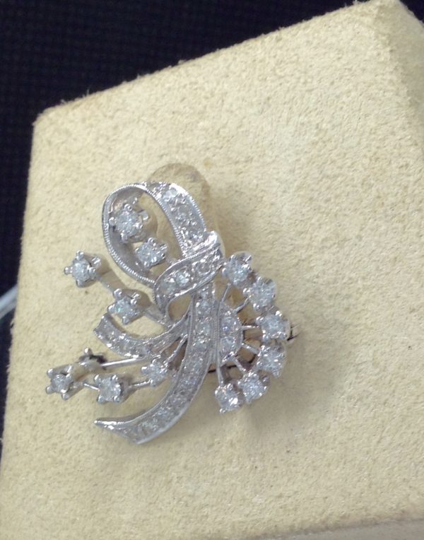 Side view of 1.00 Ct Diamond Antique Brooch 14k White Gold 1" Long on a jewelry vox