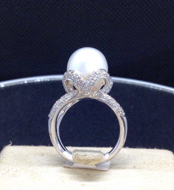 Stunning 18k White Gold Ring with a 12mm South Sea Pearl and 0.75 Ct Diamonds on a jewelry box
